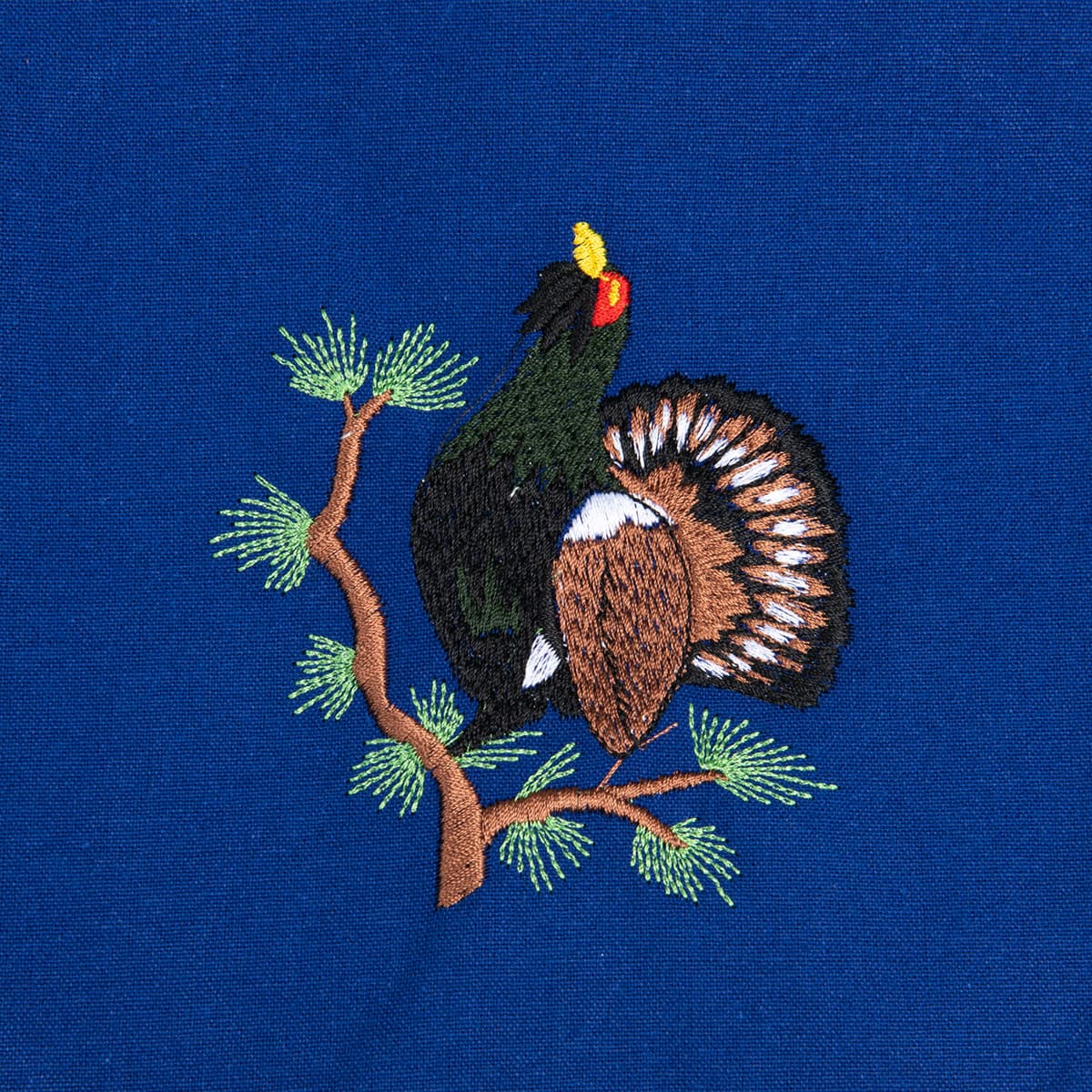 Tablier bleu avec motif : coq de bruy�re